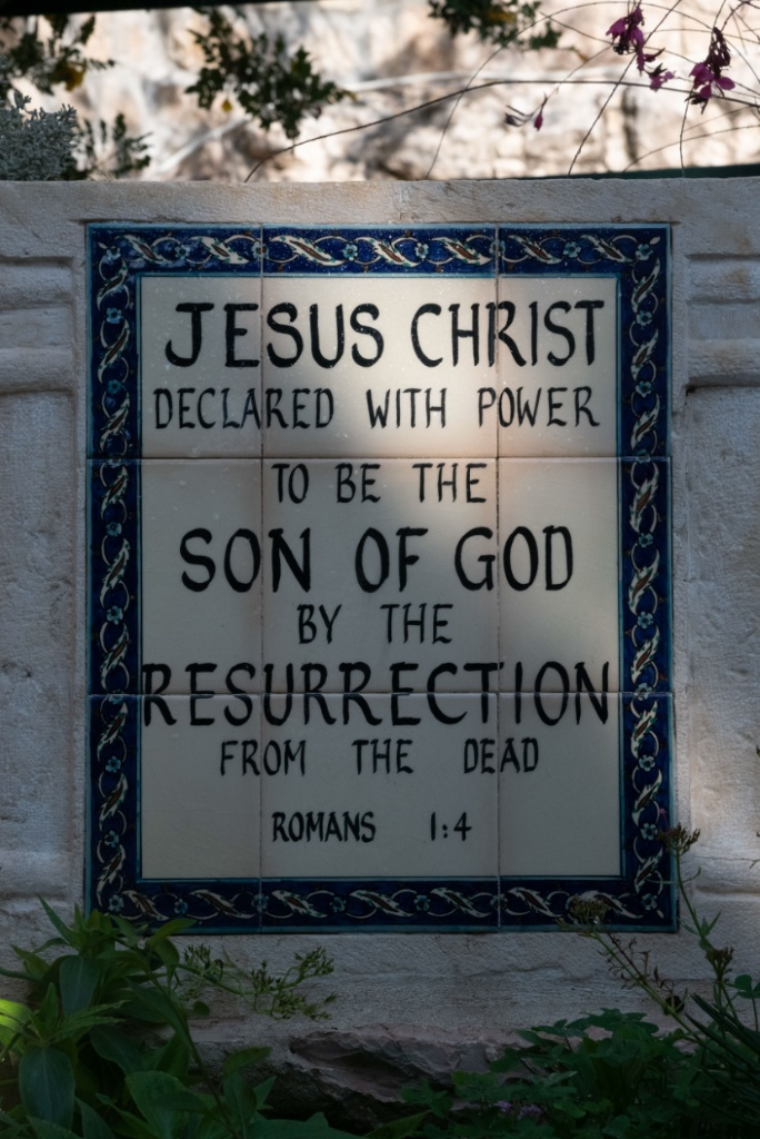 Tile sign at the Garden Tomb, Jerusalem — Jesus Christ declared with power to be the Son of God by the Resurrection from the dead · Romans 1:4