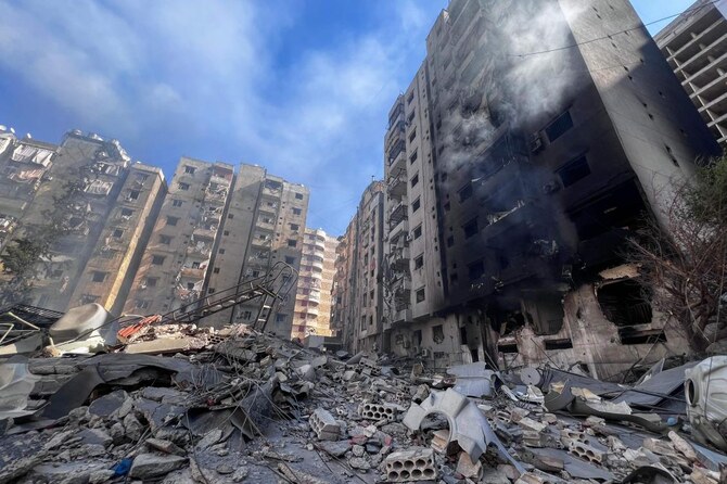 Dahiyeh southern Beirut - multi-storey apartment blocks destroyed by Israeli airstrikes, rubble-filled streets, 2024