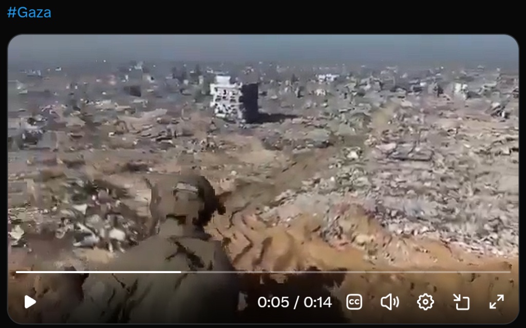 #Gaza: aerial drone footage of Gaza 2026. Horizon-to-horizon rubble. A single half-standing building visible in a field of total destruction.